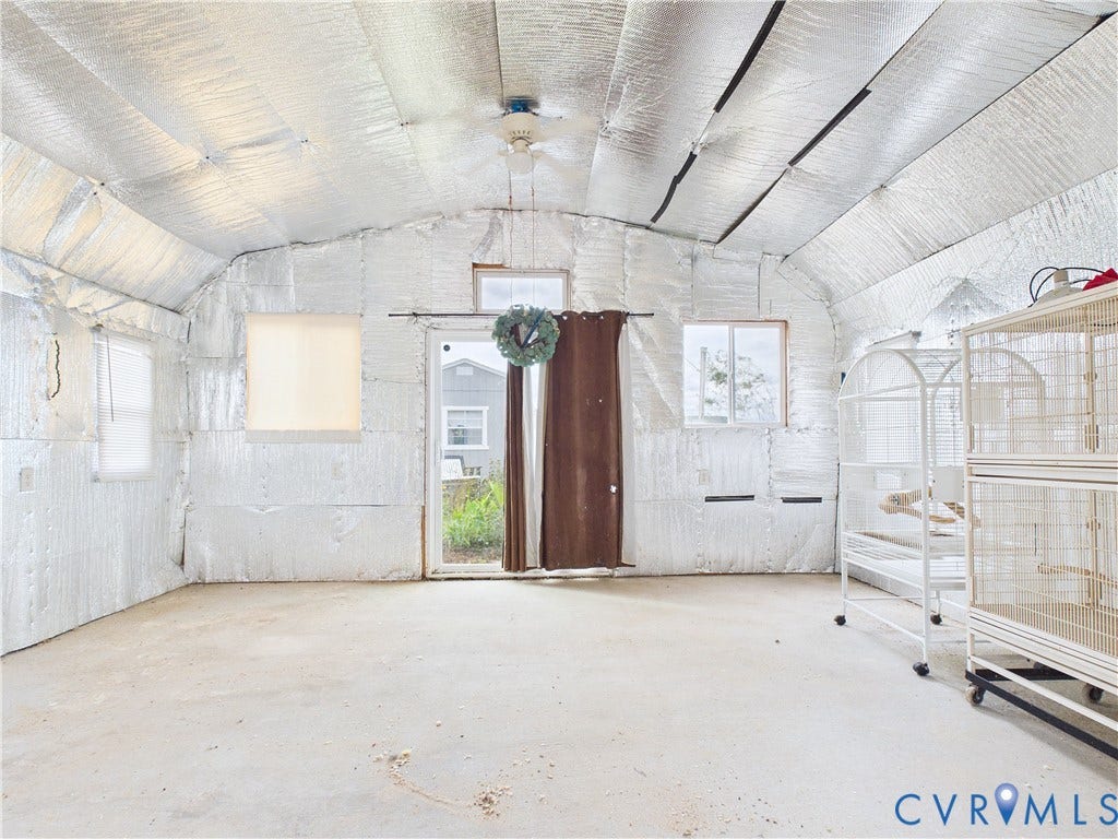 290 Western Lane, Appomattox, Appomattox, VA 24522 Interior space featuring reflective foil insulation, vaulted ceiling, concrete flooring, sliding glass door, and dual windows