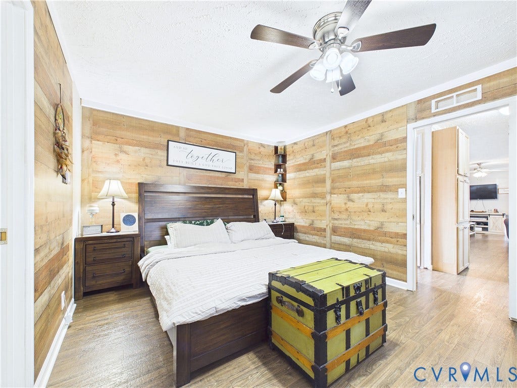 290 Western Lane, Appomattox, Appomattox, VA 24522 Room featuring horizontal wood plank wall paneling, wood-finish flooring, and a ceiling fan with integrated lighting