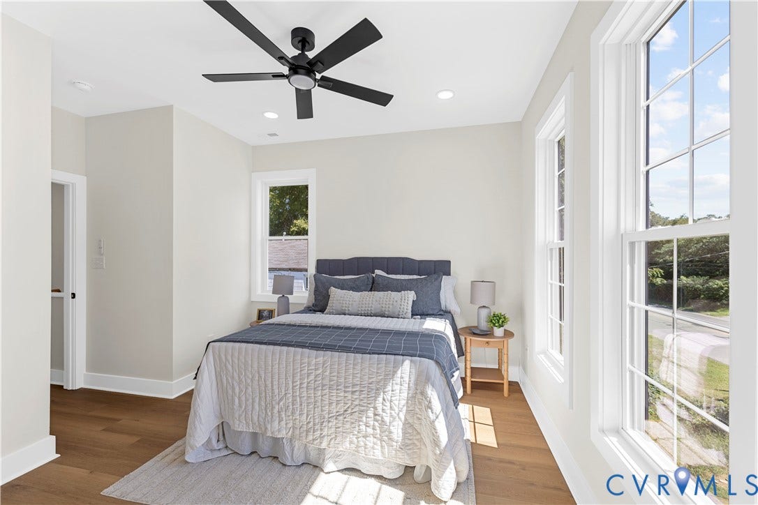 851 E Bank Street, Old Towne, Petersburg, VA 23803 Neutral-toned interior featuring wood-finish flooring, multi-pane windows, recessed lighting, and a modern matte black ceiling fan