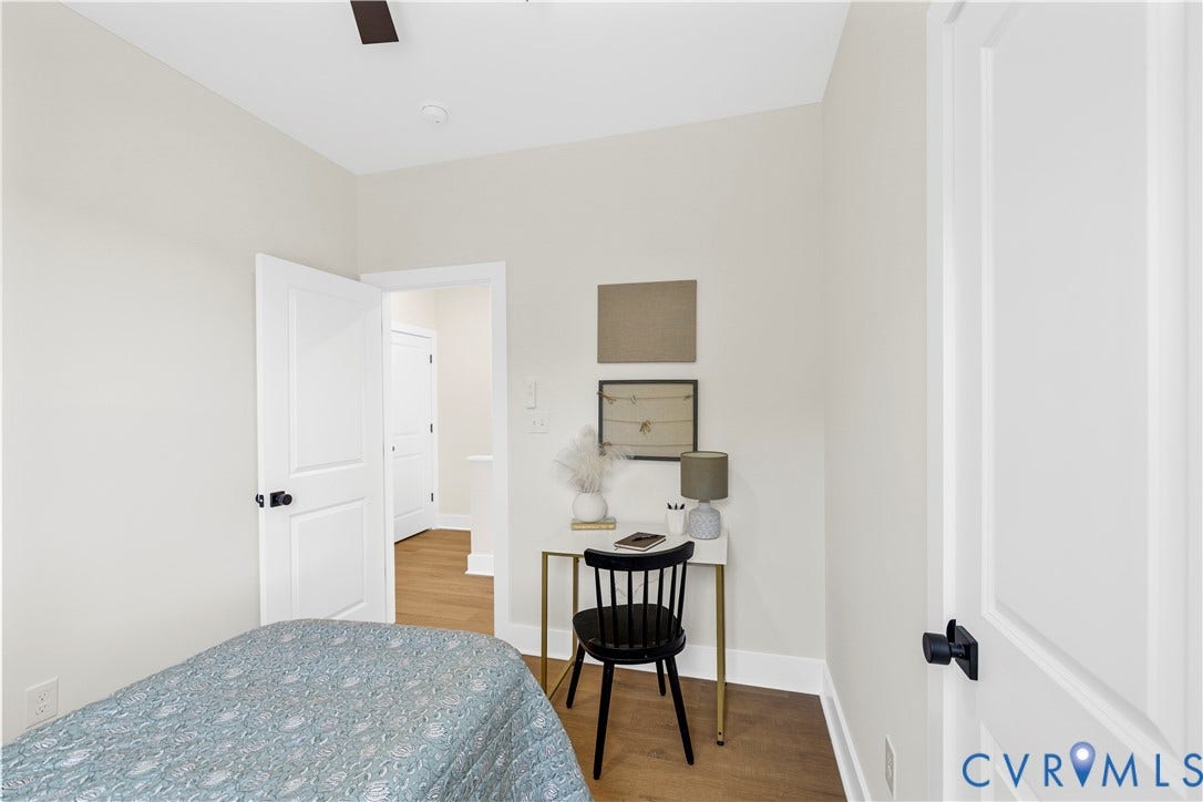 851 E Bank Street, Old Towne, Petersburg, VA 23803 Neutral wall paint, wood-finish flooring, and two-panel interior doors with matte black hardware