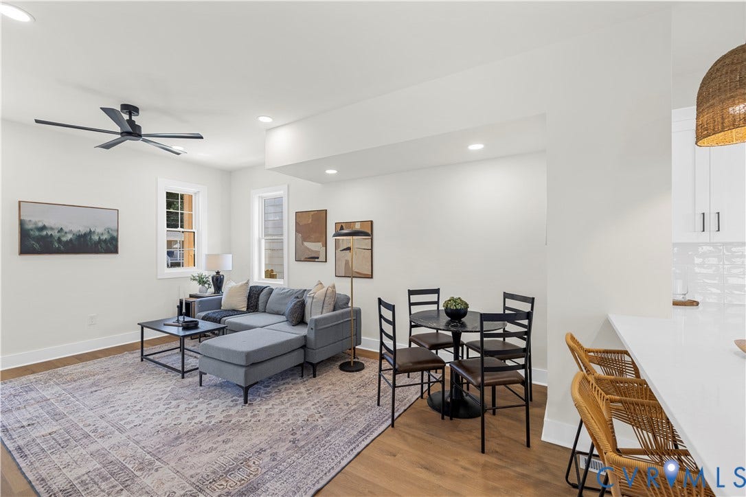 851 E Bank Street, Old Towne, Petersburg, VA 23803 Open-concept space featuring wood-finish flooring, a matte black ceiling fan, recessed lighting, and a kitchen peninsula with a solid-surface countertop