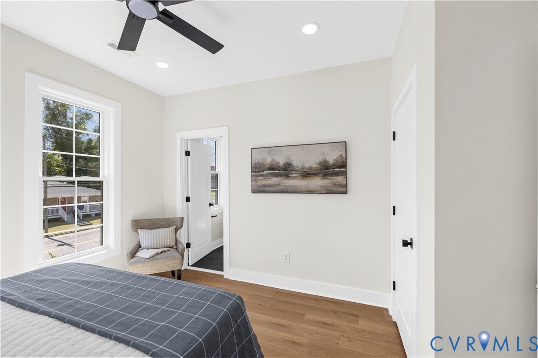 851 E Bank Street, Old Towne, Petersburg, VA 23803 Room featuring wood-finish flooring, recessed lighting, a matte black ceiling fan, and a multi-pane window with white trim