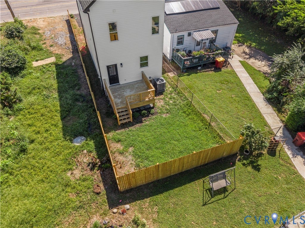 851 E Bank Street, Old Towne, Petersburg, VA 23803 Rear exterior featuring a wood deck with stairs, a fenced-in yard, and vinyl siding