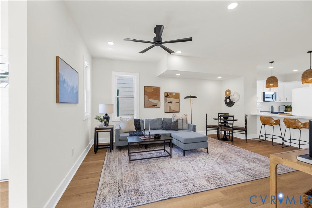 851 E Bank Street, Old Towne, Petersburg, VA 23803 Open-concept interior featuring wood-finish flooring, recessed lighting, a modern matte black ceiling fan, and a breakfast bar with dual pendant lighting