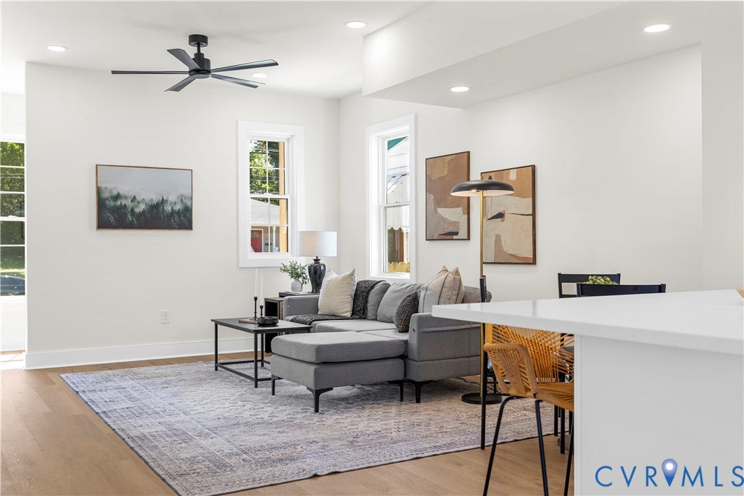 851 E Bank Street, Old Towne, Petersburg, VA 23803 Open floor plan featuring wood-finish flooring, recessed lighting, matte black ceiling fan, and large windows with white trim