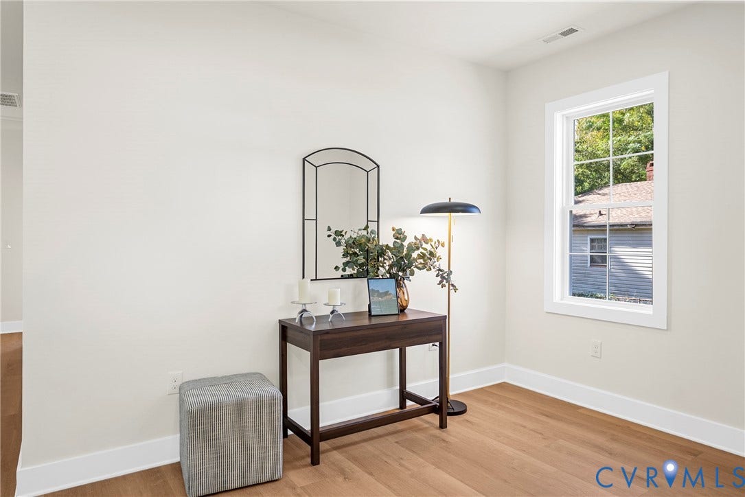 1420 Ferndale Avenue, Petersburg, VA 23803 Neutral wall tones, wood-finish flooring, and a single-hung window with muntin grid detailing