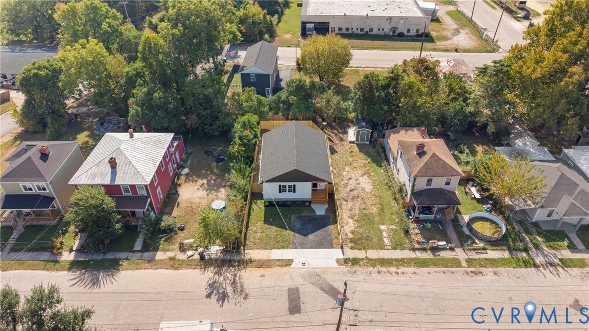 1420 Ferndale Avenue, Petersburg, VA 23803 Aerial perspective featuring a detached residential structure with a shingled roof, paved driveway, and rear wooden fencing