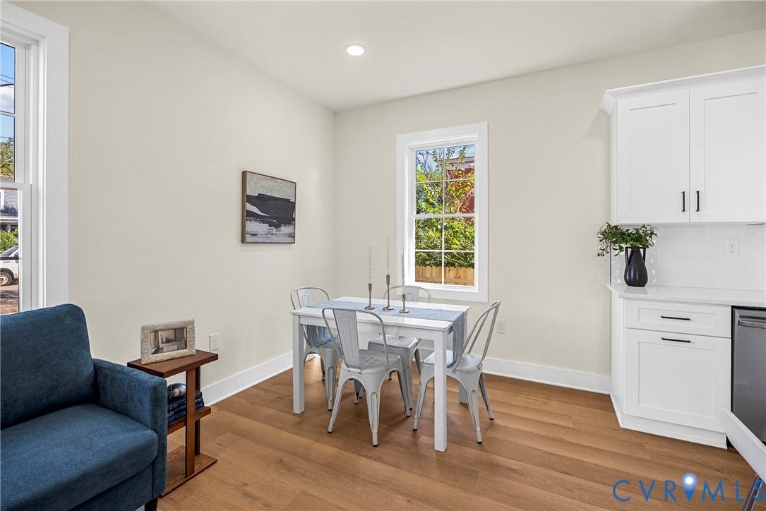 1420 Ferndale Avenue, Petersburg, VA 23803 Wood-finish flooring, white shaker-style cabinetry with dark hardware, recessed lighting, and dual-pane windows