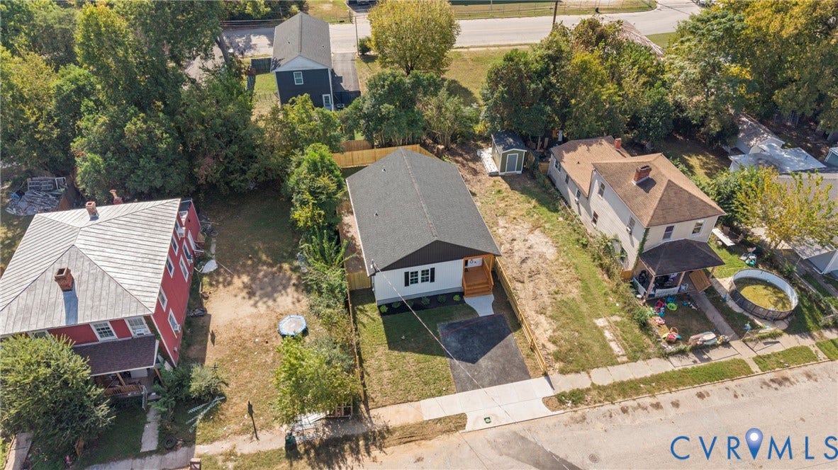 1420 Ferndale Avenue, Petersburg, VA 23803 Single-story residence featuring a dark shingled roof, light-colored siding, a paved front driveway, and a wood-decked front entrance