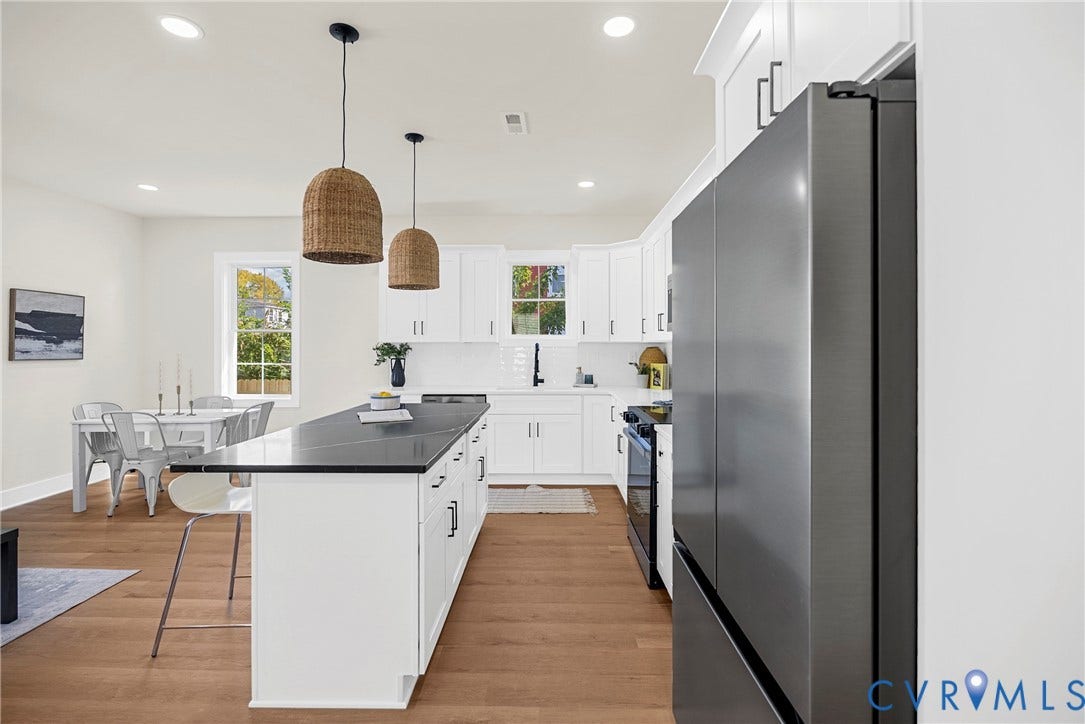 1420 Ferndale Avenue, Petersburg, VA 23803 Kitchen featuring white shaker-style cabinetry, dark stone countertops, stainless steel appliances, wood-finish flooring, and dual woven pendant lights