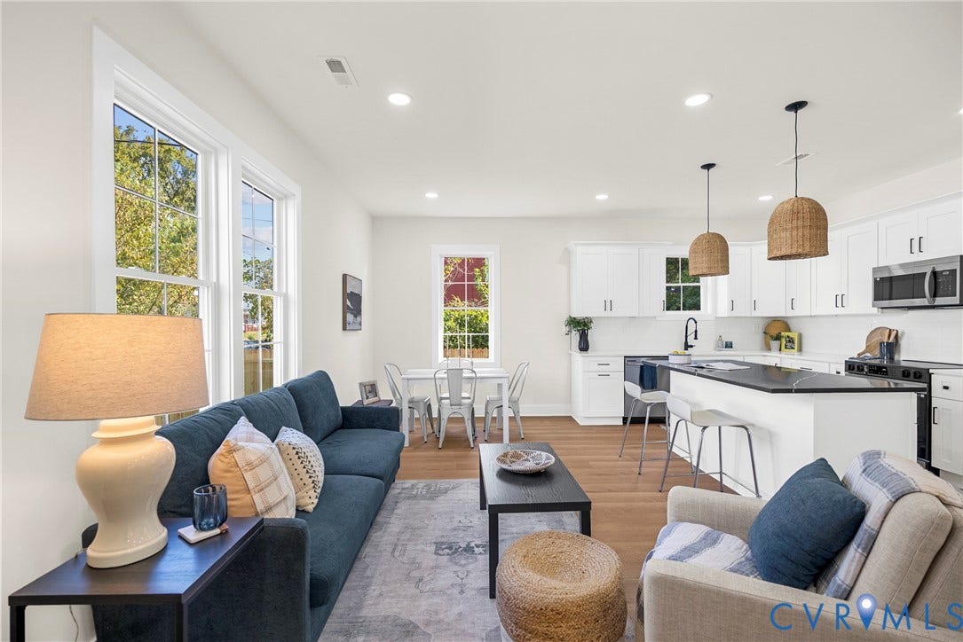 1420 Ferndale Avenue, Petersburg, VA 23803 Open-concept living space featuring wood-finish flooring, recessed lighting, white cabinetry, a center island with a dark countertop, and large windows