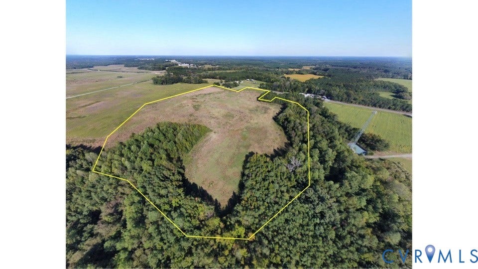 0 Pine Log Road, Skippers, VA 23879 Expansive acreage featuring cleared open terrain, dense perimeter woodlands, and defined boundary lines