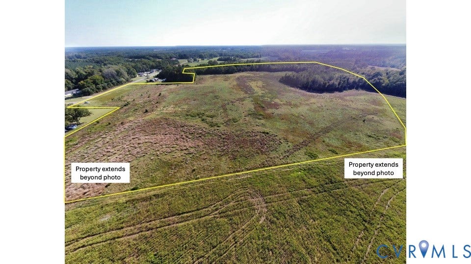 0 Pine Log Road, Skippers, VA 23879 Expansive acreage featuring cleared open terrain, natural meadow grasses, and established perimeter tree lines