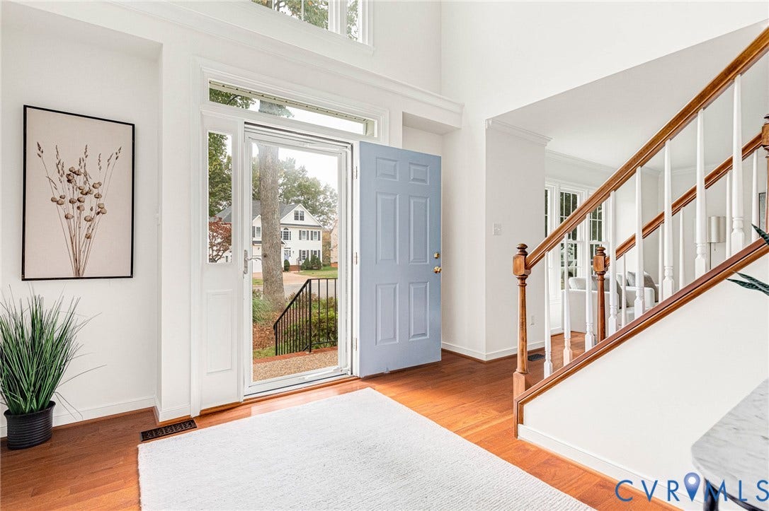 3629 Milbury Run Street, Henrico, VA 23233 Foyer featuring soaring ceilings, wood-finish flooring, a wood-railing staircase, and a glass-paneled entry door with transom window
