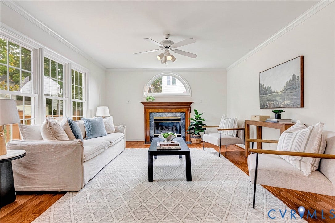 3629 Milbury Run Street, Henrico, VA 23233 Hardwood flooring, multi-pane windows, arched window feature, and fireplace with decorative mantel and surround