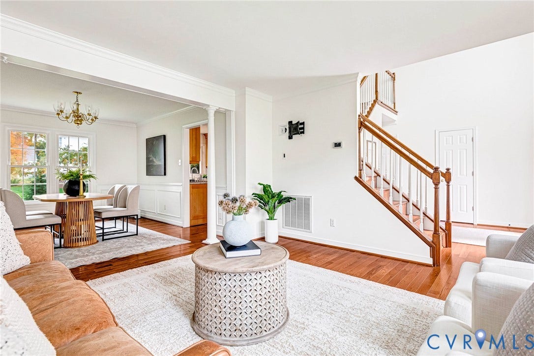 3629 Milbury Run Street, Henrico, VA 23233 Interior featuring wood-finish flooring, a traditional staircase with a wooden handrail, wainscoting detail, crown molding, and a built-in column