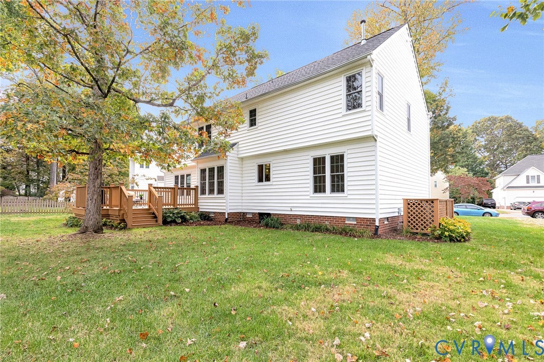 3629 Milbury Run Street, Henrico, VA 23233 Two-story residence featuring white horizontal siding, a brick foundation, a raised wood deck with balustrades, and multi-pane windows