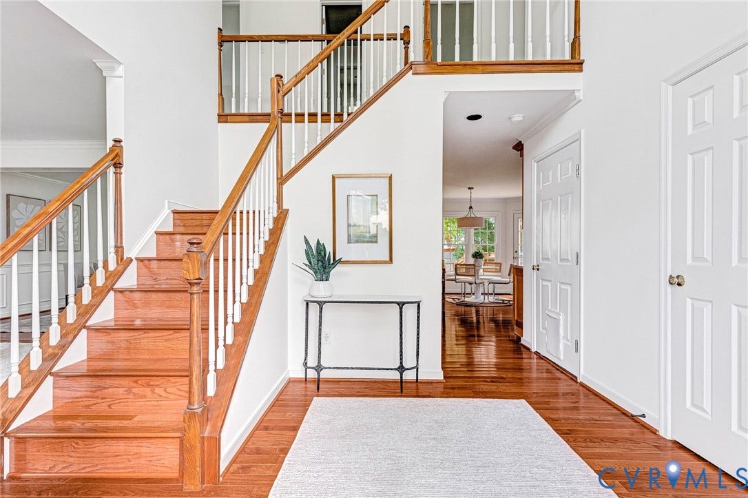 3629 Milbury Run Street, Henrico, VA 23233 Foyer featuring wood-finish flooring, a wooden staircase with white balusters, and crown molding