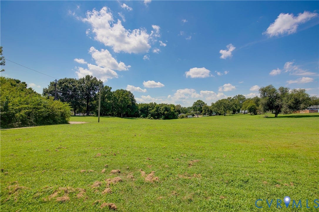 1809 Sussex Street, Whitcomb, Richmond, VA 23223 Expansive open lot featuring level topography and mature perimeter trees