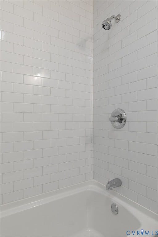 1809 Sussex Street, Whitcomb, Richmond, VA 23223 Full-height white subway tile surround with a polished chrome shower head, matching single-handle pressure balance valve, and standard porcelain tub