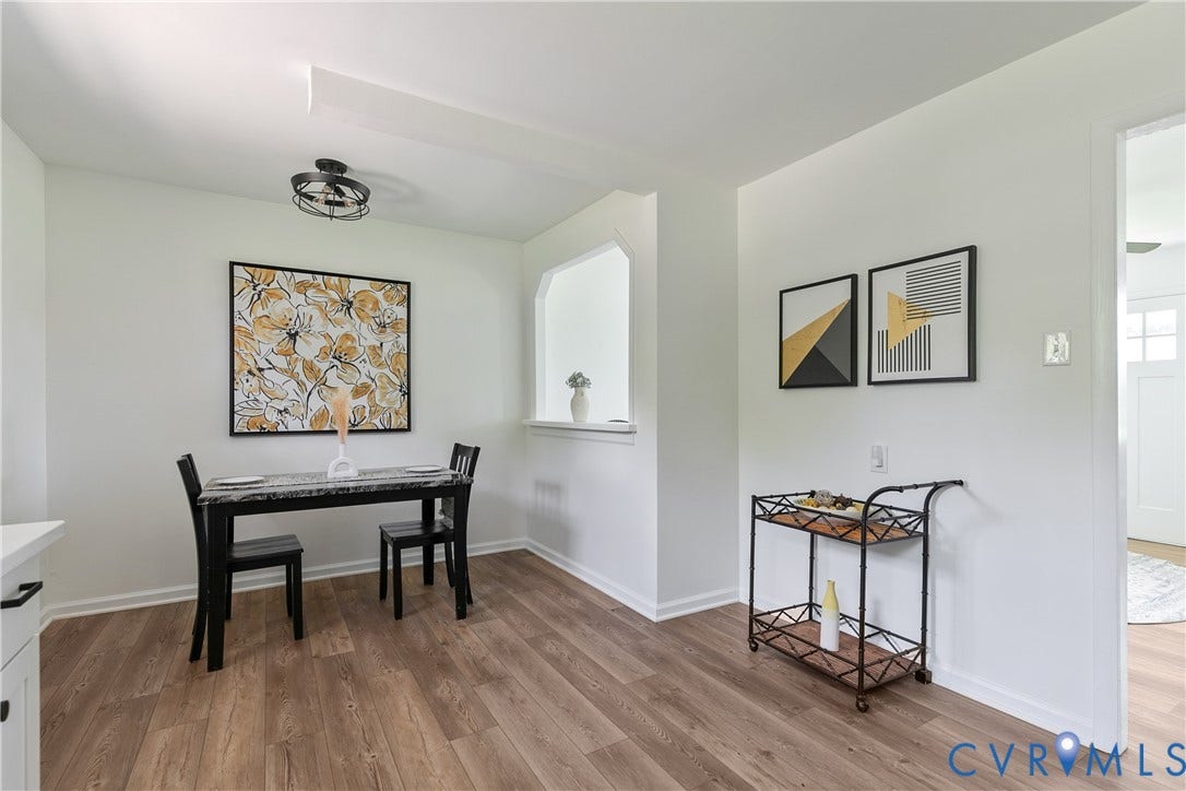 1809 Sussex Street, Whitcomb, Richmond, VA 23223 Wood-finish flooring, architectural wall cutout, and industrial-style flush mount ceiling lighting