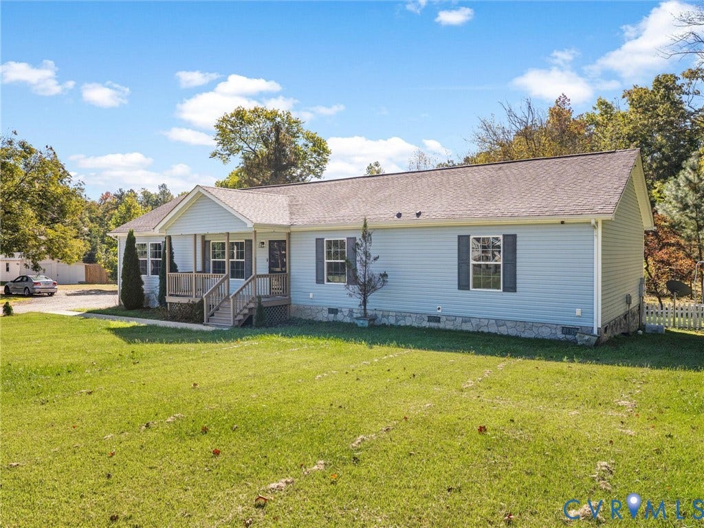 1625 Cedar Lane, Powhatan, VA 23139 Single-story residence featuring light blue siding, a stone veneer foundation, a covered front porch, and dark-toned window shutters