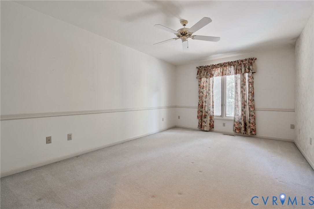 10862 Walton Lake Road, Dick Woods Subdivision, Disputanta, VA 23842 Interior space featuring carpeting, chair rail molding, and a ceiling fan
