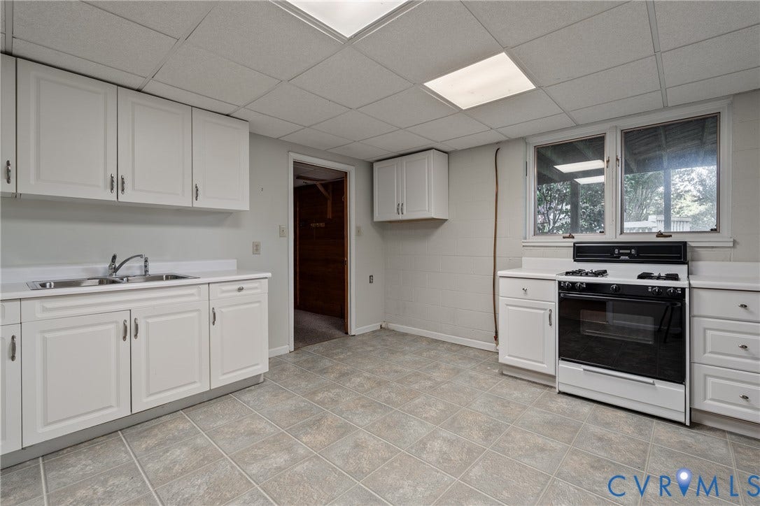 10862 Walton Lake Road, Dick Woods Subdivision, Disputanta, VA 23842 Kitchen featuring white cabinetry, built-in range, dual-basin stainless steel sink, tile flooring, and drop ceiling