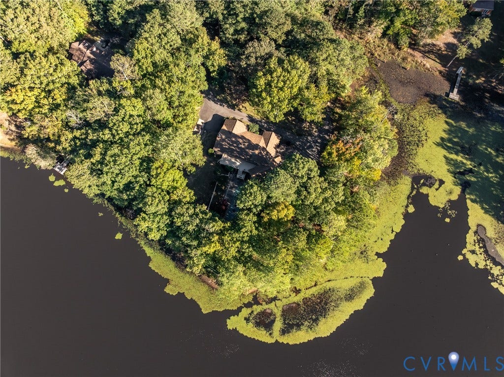10862 Walton Lake Road, Dick Woods Subdivision, Disputanta, VA 23842 Waterfront property featuring extensive perimeter shoreline, mature woodland canopy, private paved driveway, and detached structure