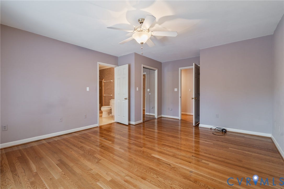 10862 Walton Lake Road, Dick Woods Subdivision, Disputanta, VA 23842 Room featuring wood-finish flooring, a ceiling fan with integrated lighting, and mirrored sliding closet doors