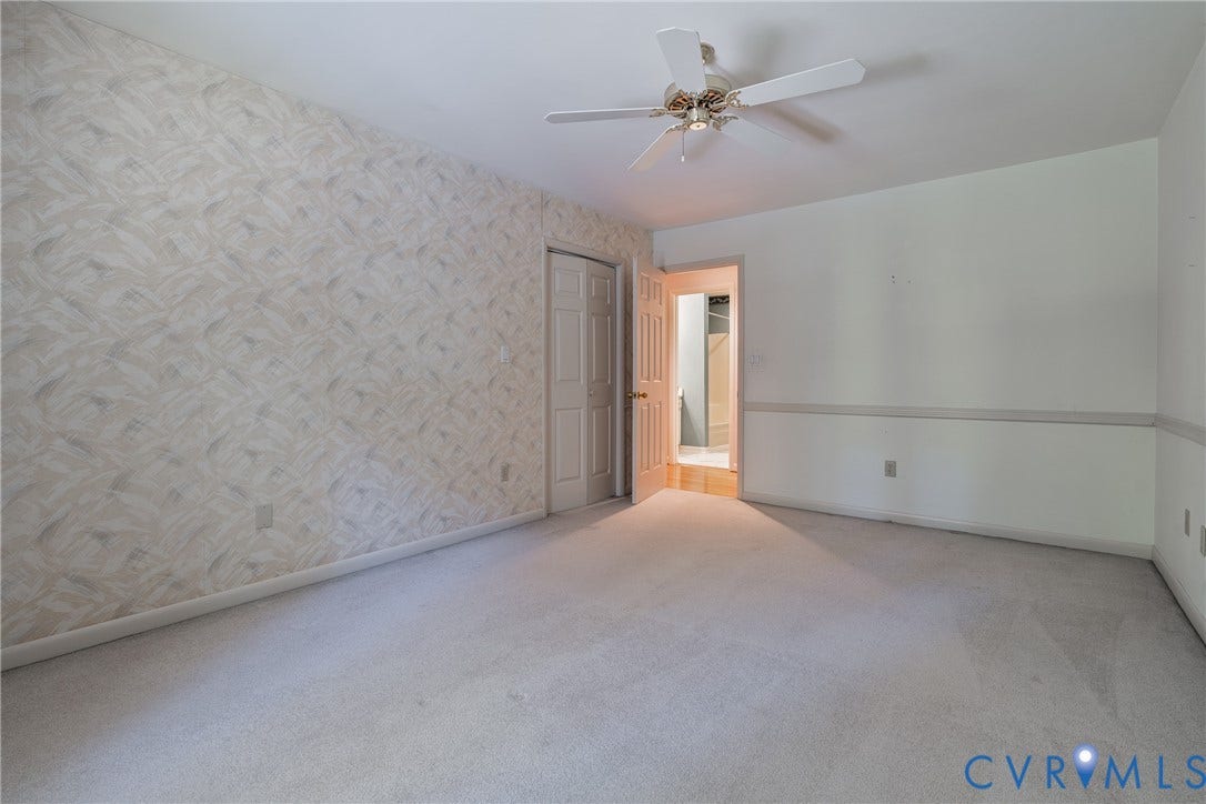 10862 Walton Lake Road, Dick Woods Subdivision, Disputanta, VA 23842 Room featuring textured wallpaper, neutral carpeting, a ceiling-mounted fan, and double-panel closet doors
