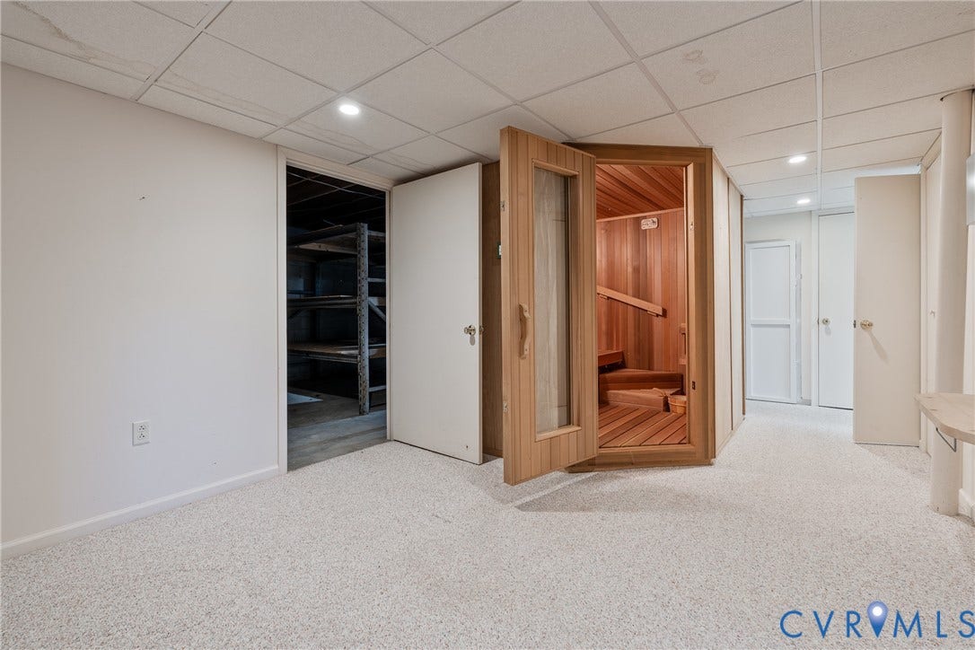 10862 Walton Lake Road, Dick Woods Subdivision, Disputanta, VA 23842 Custom-built cedar sauna with a glass-paneled door, recessed lighting, and wall-to-wall carpeting