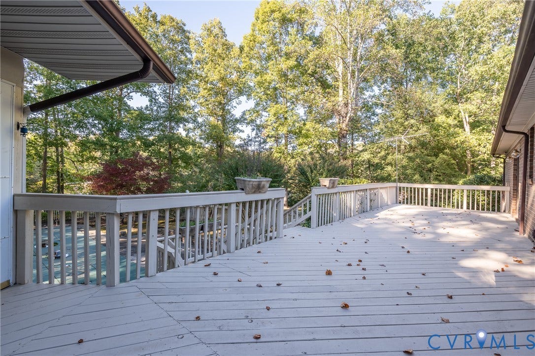 10862 Walton Lake Road, Dick Woods Subdivision, Disputanta, VA 23842 Expansive multi-level wood deck featuring white railing and integrated stairs