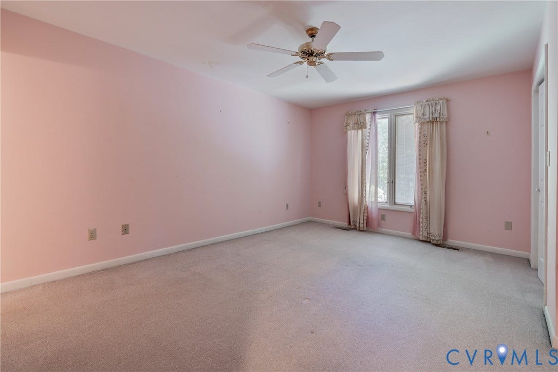 10862 Walton Lake Road, Dick Woods Subdivision, Disputanta, VA 23842 Interior room featuring wall-to-wall carpeting, a ceiling fan with integrated lighting, and a multi-panel window