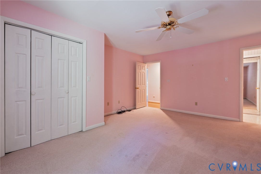10862 Walton Lake Road, Dick Woods Subdivision, Disputanta, VA 23842 Room featuring carpeted flooring, a four-panel bi-fold closet, and a ceiling-mounted fan with integrated light fixture