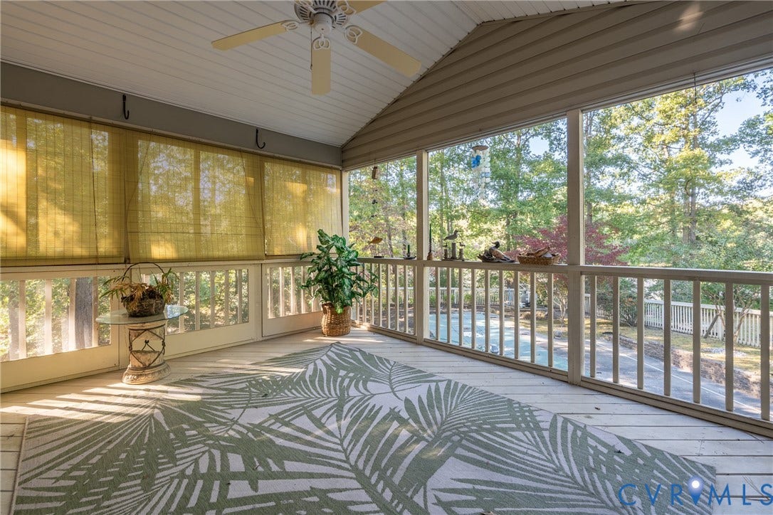10862 Walton Lake Road, Dick Woods Subdivision, Disputanta, VA 23842 Screened-in porch featuring painted wood decking, a vaulted ceiling, and an integrated ceiling fan