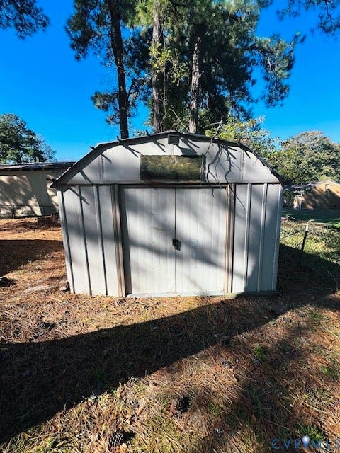 1525 Circle Drive, Petersburg, VA 23803 Metal storage shed with a gambrel roof and double-door entry