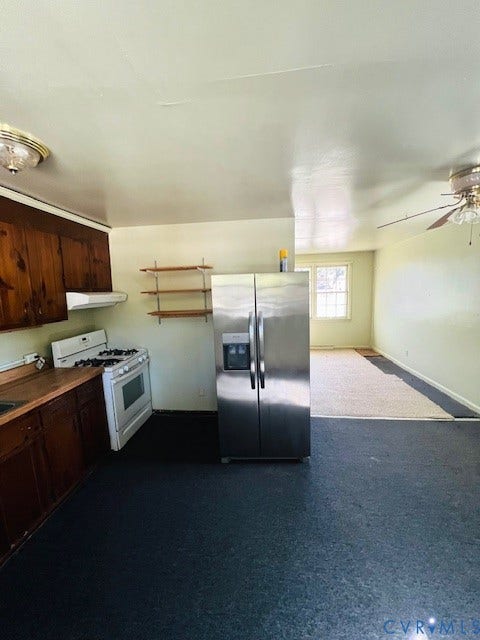 1525 Circle Drive, Petersburg, VA 23803 Kitchen featuring wood cabinetry, stainless steel side-by-side refrigerator, white gas range with overhead exhaust hood, and wall-mounted shelving