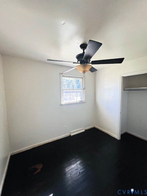 1525 Circle Drive, Petersburg, VA 23803 Interior space featuring wood-finish flooring, a ceiling fan with integrated lighting, a window, and a reach-in closet with an installed rod
