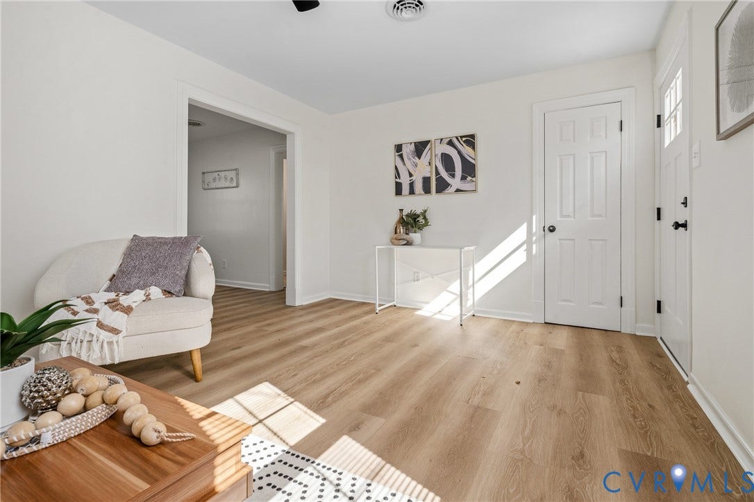 2106 Kenwood Avenue, Henrico, VA 22229 Neutral-toned interior featuring wood-finish flooring, a six-panel door, and a front entry door with integrated glass panes