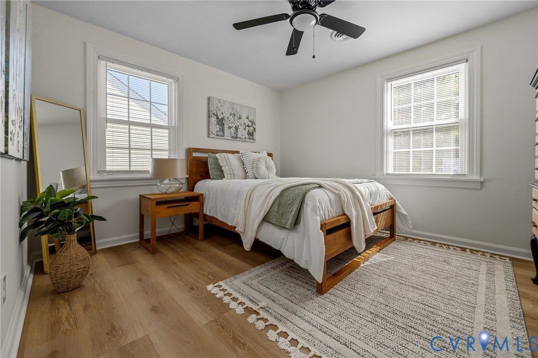 2106 Kenwood Avenue, Henrico, VA 22229 Wood-finish flooring, dual windows with grid detailing, and a ceiling fan with an integrated light fixture
