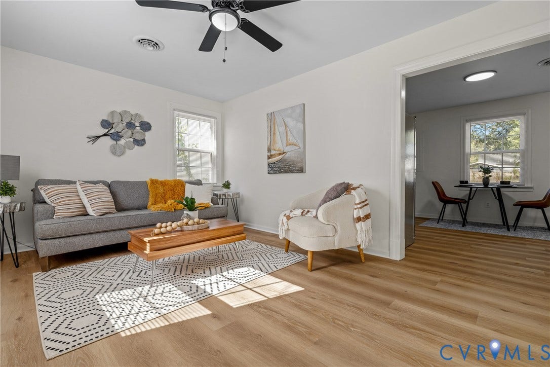 2106 Kenwood Avenue, Henrico, VA 22229 Living area featuring wood-finish flooring, a ceiling fan with integrated lighting, and multiple windows