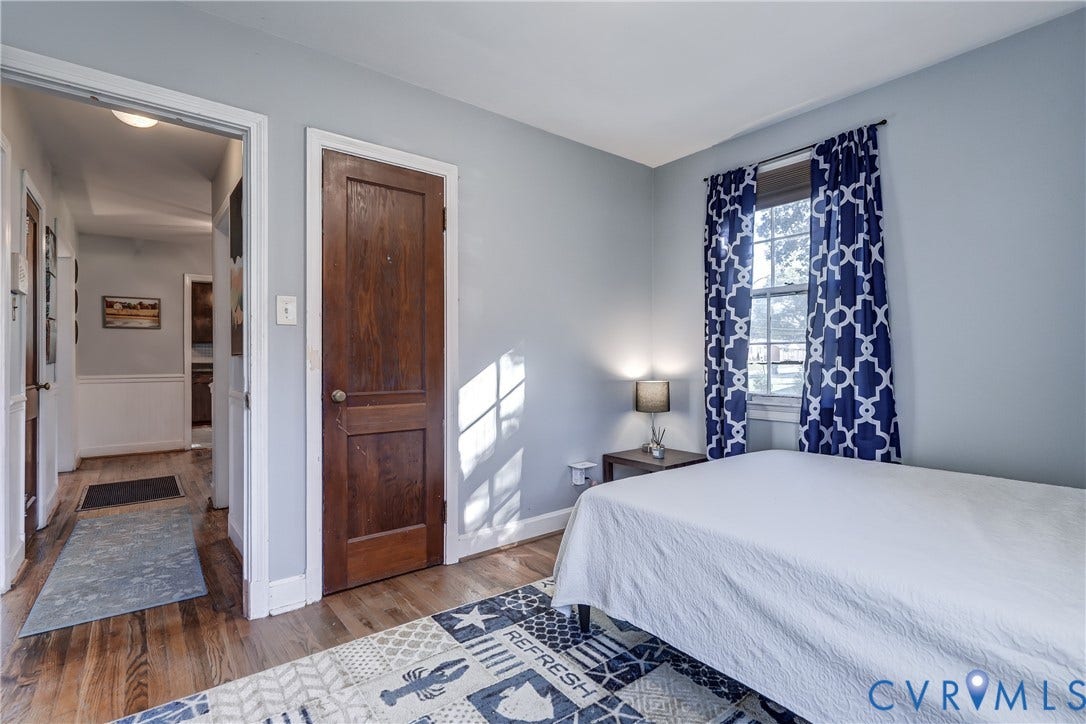 4007 Austin Avenue, Richmond, VA 23222 Interior room featuring wood-finish flooring, a solid wood-panel door, and a single-hung window