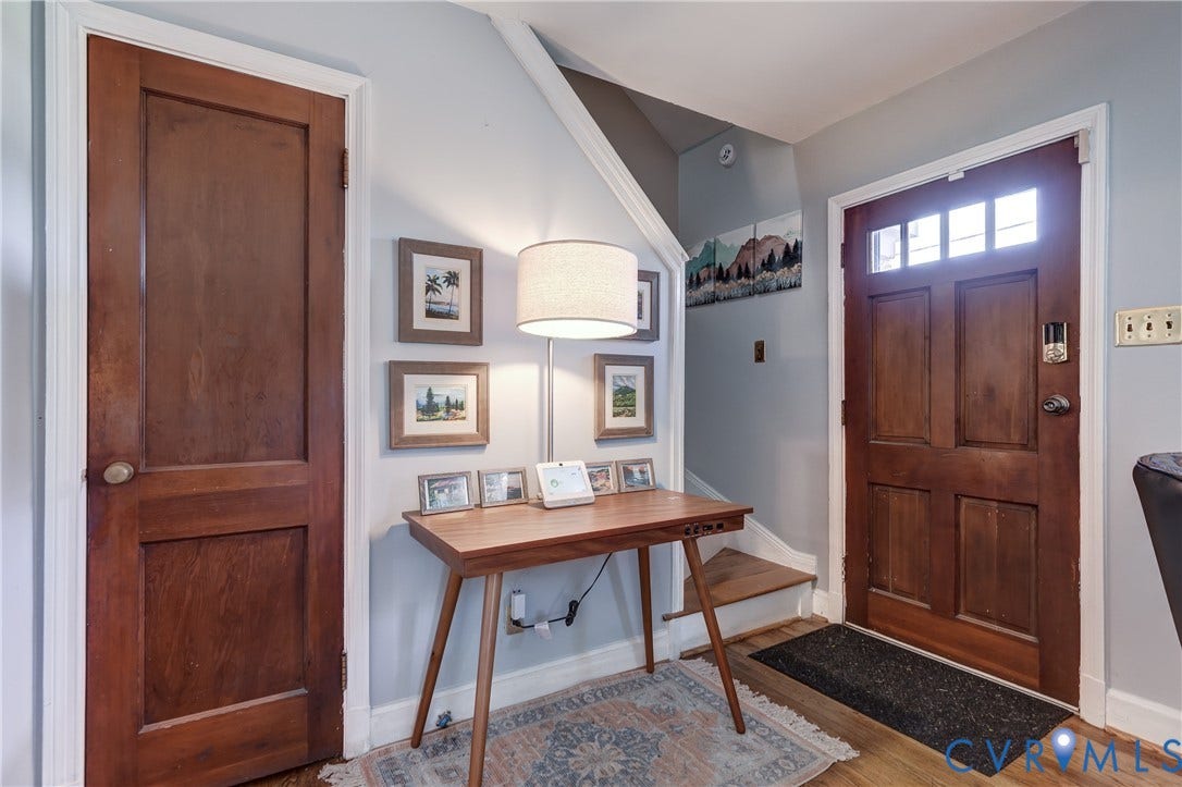 4007 Austin Avenue, Richmond, VA 23222 Entryway featuring a solid wood door with multi-pane transom glass, traditional wood-finish interior door, and wood-finish flooring