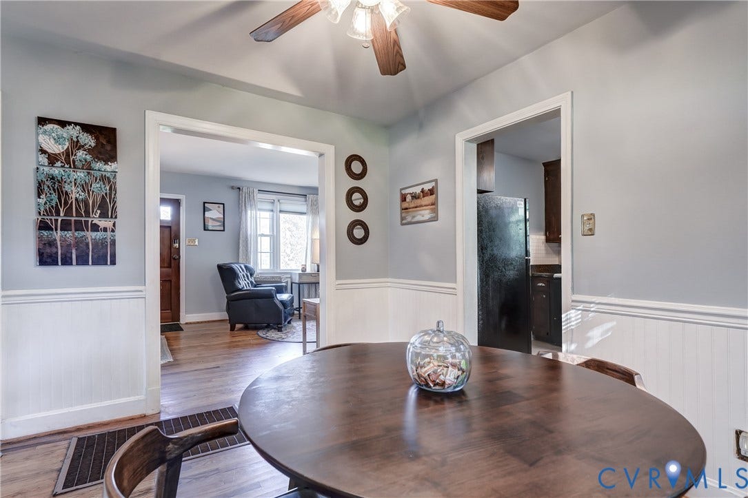4007 Austin Avenue, Richmond, VA 23222 Interior space featuring wood-finish flooring, white wainscoting, and a ceiling-mounted fan