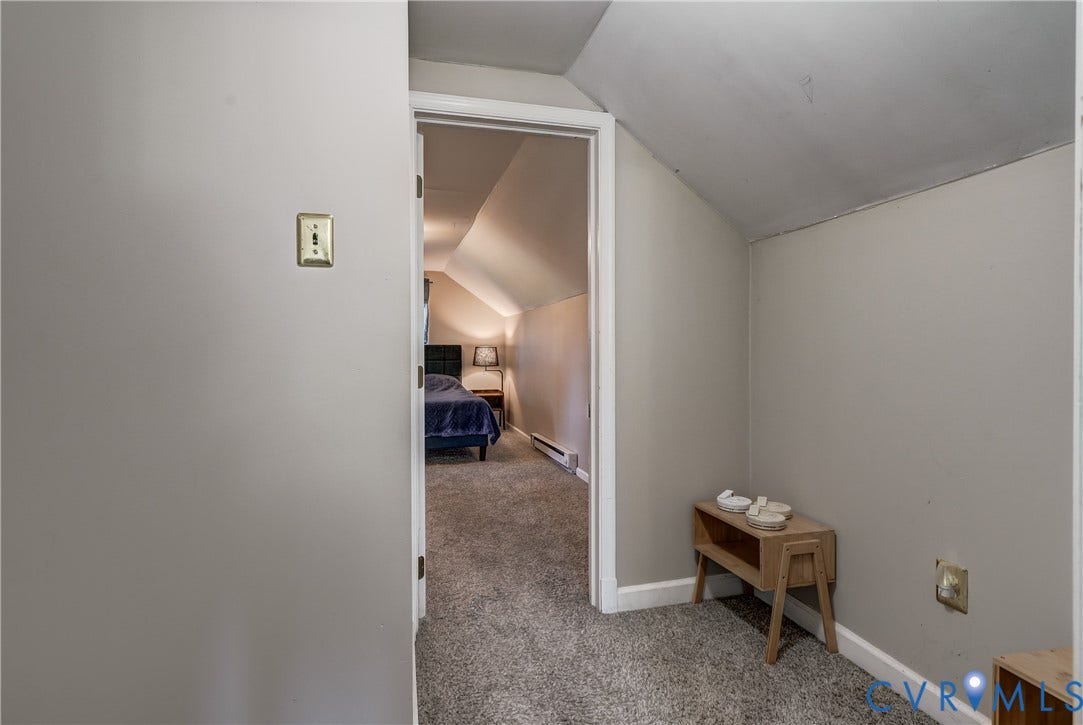 4007 Austin Avenue, Richmond, VA 23222 Sloped ceilings with neutral-toned paint and plush carpeting