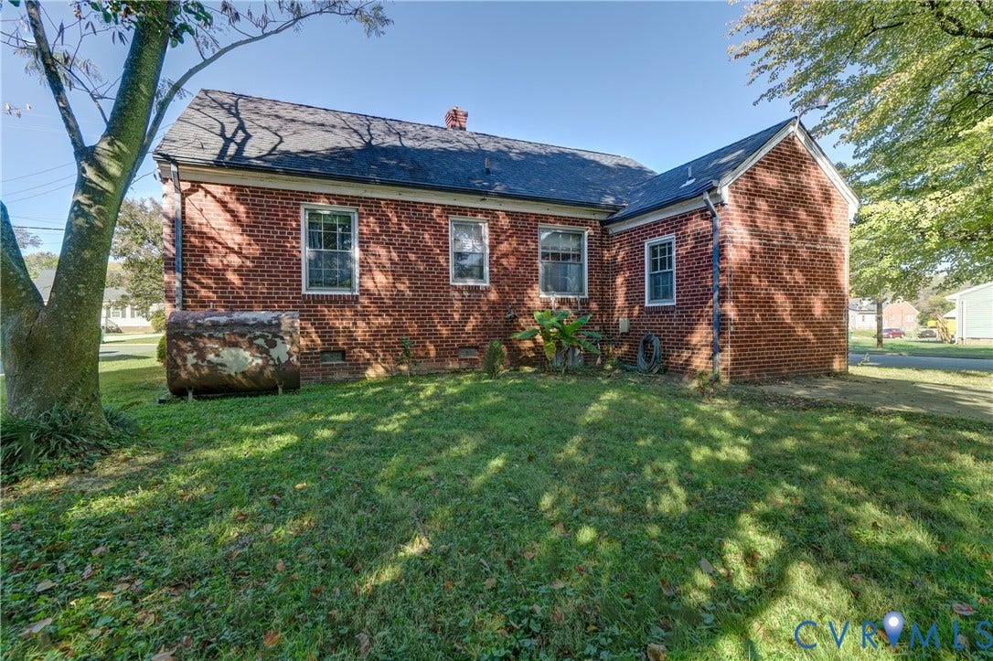 4007 Austin Avenue, Richmond, VA 23222 Red brick exterior featuring a multi-gable roofline, asphalt shingles, and multi-pane windows