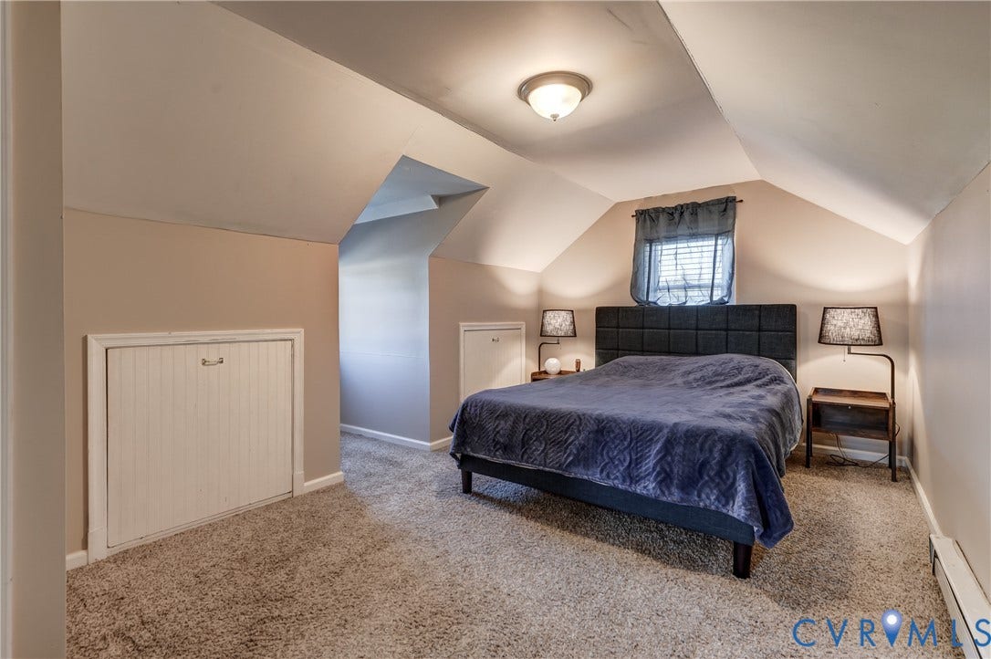 4007 Austin Avenue, Richmond, VA 23222 Room featuring vaulted ceilings, neutral-toned wall-to-wall carpeting, and integrated under-eave storage cabinetry