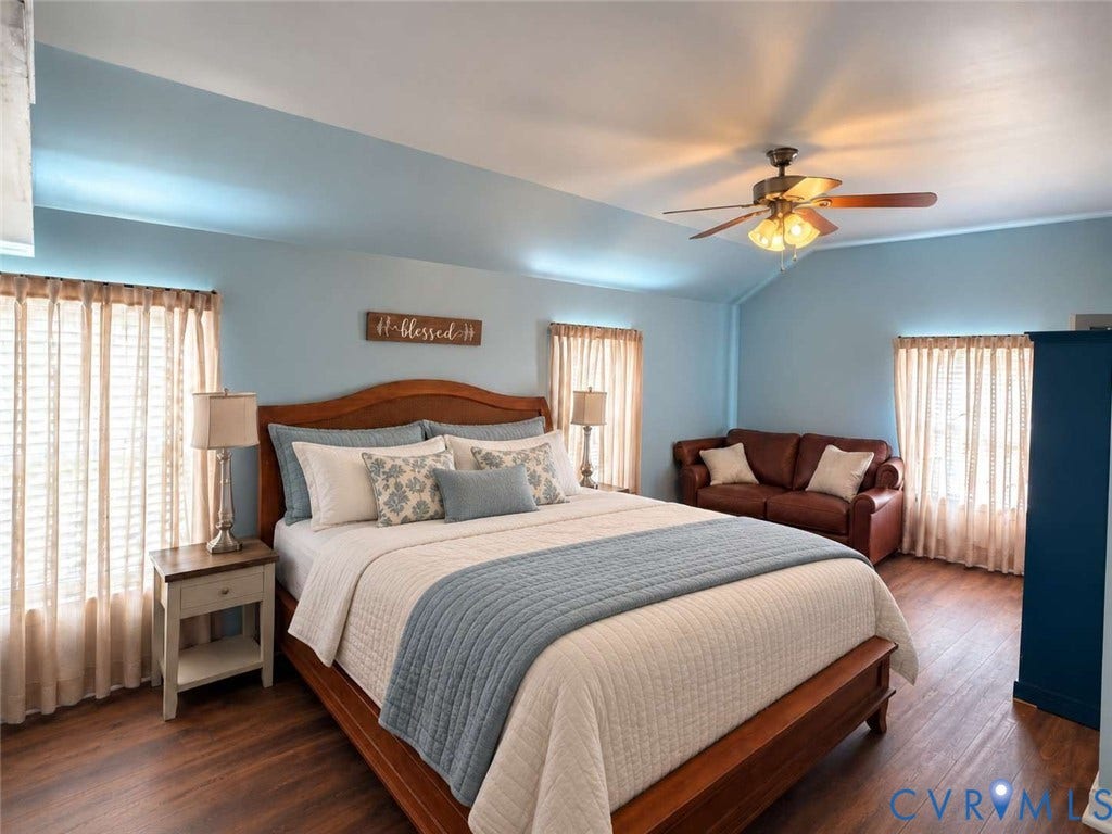 5424 Bellswood Drive, Mechanicsville, VA 23111 Vaulted ceiling, wood-finish flooring, and multiple windows with fixed window treatments