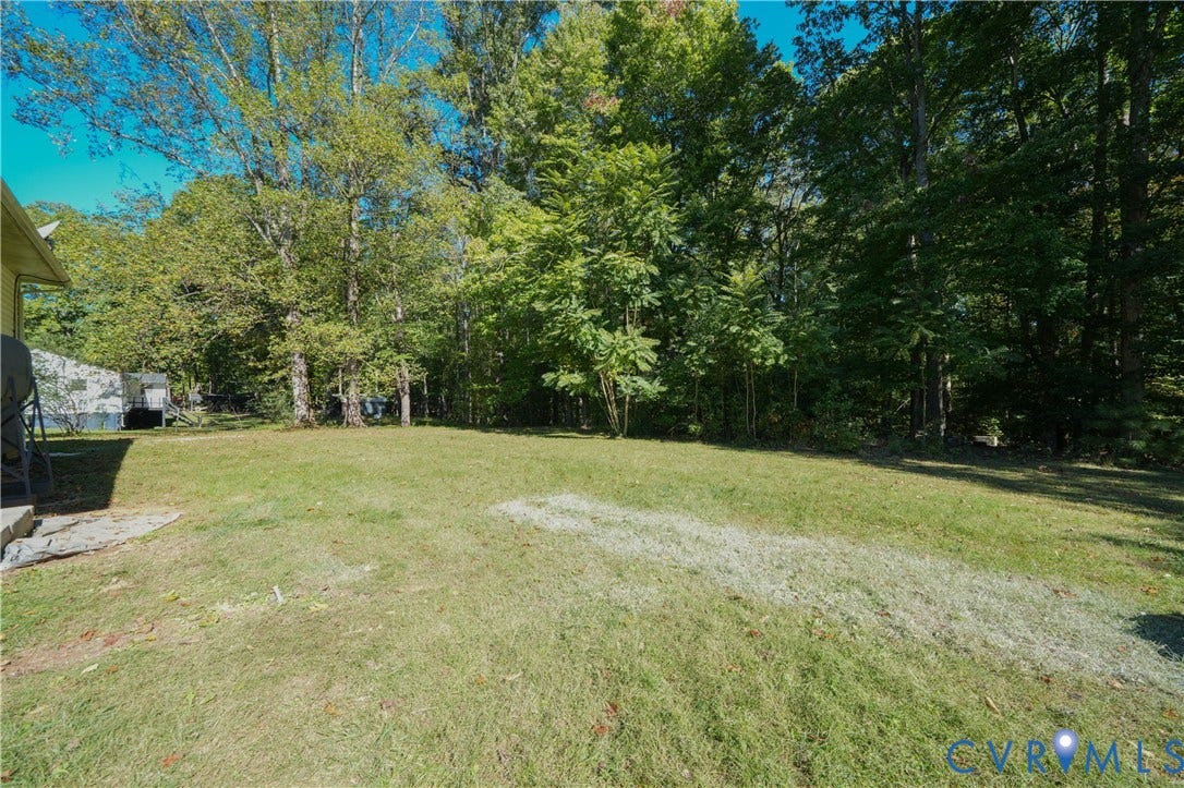 3622 New Bethel Road, Meherrin, VA 23954 Expansive backyard featuring a sprawling lawn and a perimeter of mature trees